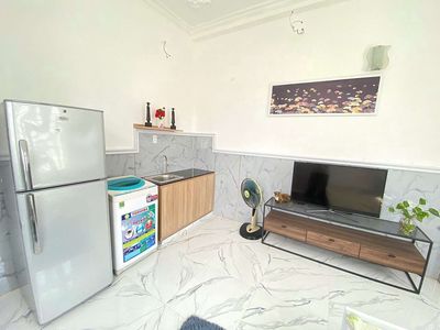 The room is wide, high-end furniture, with their own washing machine downtown.
