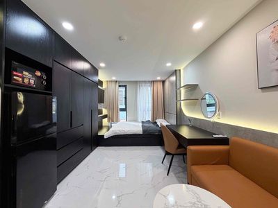 The studio apartment has open windows - elevators and private washing machines