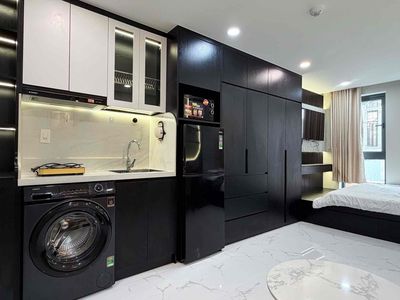 The studio apartment has open windows - elevators and private washing machines