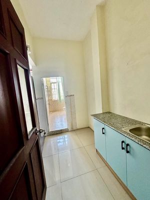 small kitchen space full of open-air furniture