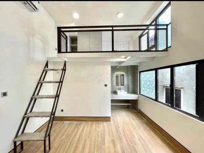 The apartment is full of furniture near the airline to District 10