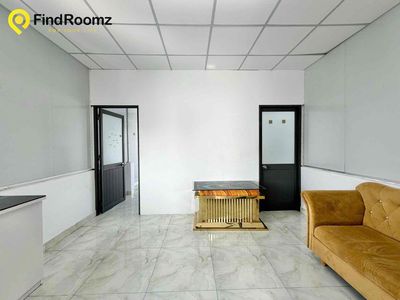 Two bedrooms. One living room. A bathroom with open windows.