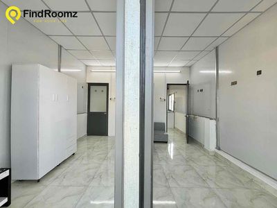 Two bedrooms. One living room. A bathroom with open windows.