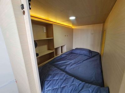 The Sleep Box dorm room is near the University of Medical College in the fifth district.