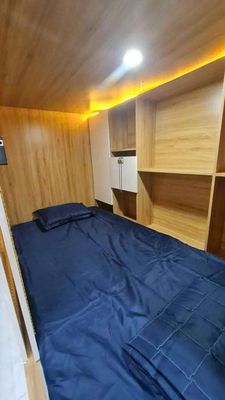 The Sleep Box dorm room is near the University of Medical College in the fifth district.
