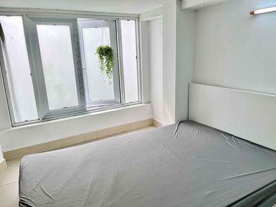 A kitchen bedroom with windows, full furniture, cool.