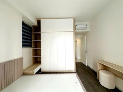 The two bedrooms have a high-end refrigerator.