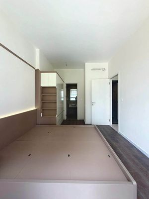The two bedrooms have a high-end refrigerator.