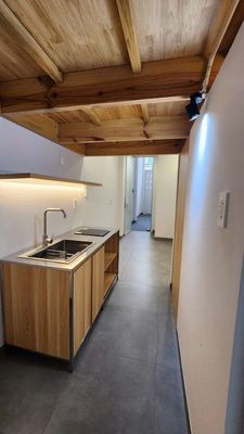 The 1st House. A floor with its own washing machine in the market.