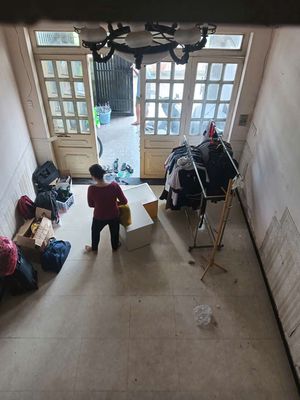 The owner of the painting hand over the house