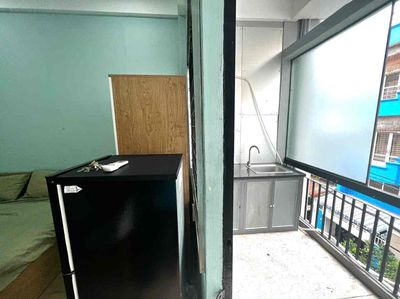 The apartment is a balcony bedroom full of furniture