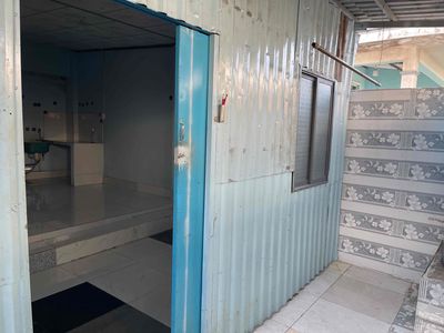 A cheap motel. A two-room safe house with a parking lot.