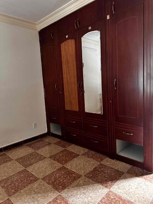 room full of basic furniture like refrigerators, air conditioning, washing machines