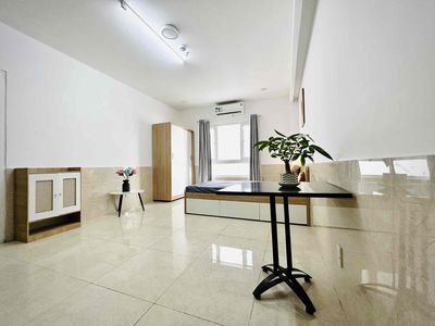 Big window studio, open elevator vault near four green rows.