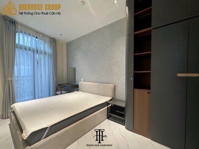 apartment one, bedroom one full interior. Bridge to District Three, room service.
