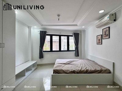 The studio. A bedroom, a clear, open window kitchen.
