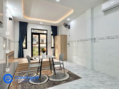 A Tây Thạnh bedroom - a cool blue balcony, and there's a market.