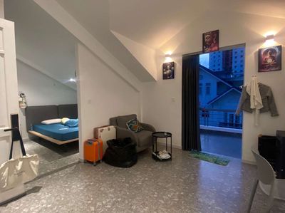 The apartment is a super wide balcony bedroom - full of furniture near Chen's brain