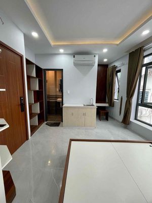 The studio apartment full of open-air furniture near the blue row