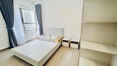 The corner of the three bedrooms for rent, there's a bed, the fridge. It's 11 million a month.