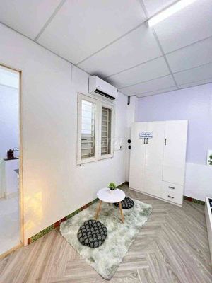 The entire 30m2 interior divided by two separate bedrooms with a kitchen.