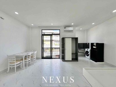 A full-house service apartment with its own balcony washing machine near the flower park