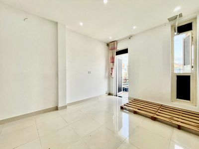 A cheap boarding room near Funky District 7 has its own balcony