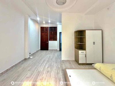 We'll rent out the kitchen studio. A super-wide bedroom with open windows.