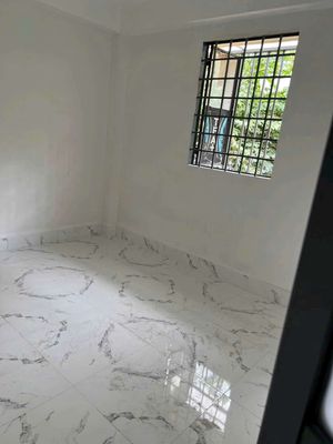 The Lê Văn Quới rental house right in the market.