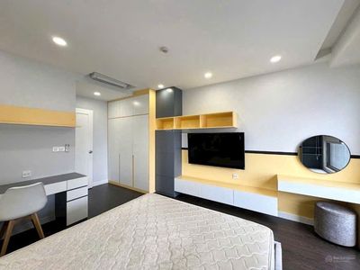 A separate bedroom not sudio with a balcony full of photos of his interior