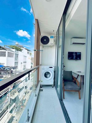 The studio has a broad balcony -- it has its own washing machine, Hòa Hảo, District 10