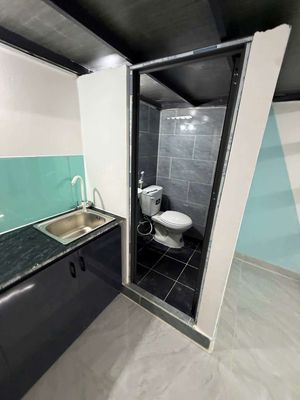 The room near the airport, five minutes from the University of Gigolos.