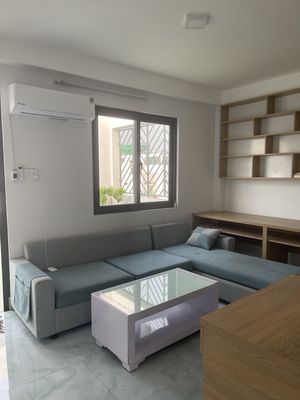 The dorm room is full of furniture-- Home sweet!
