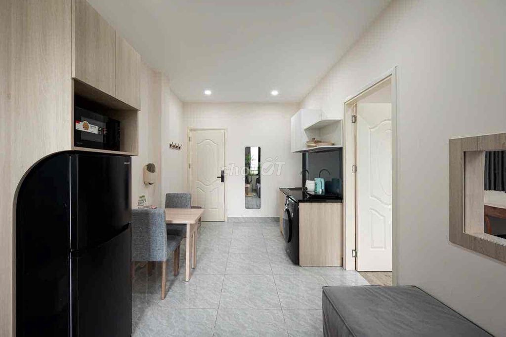 A mini apartment. A ballony bedroom. A wide open window.