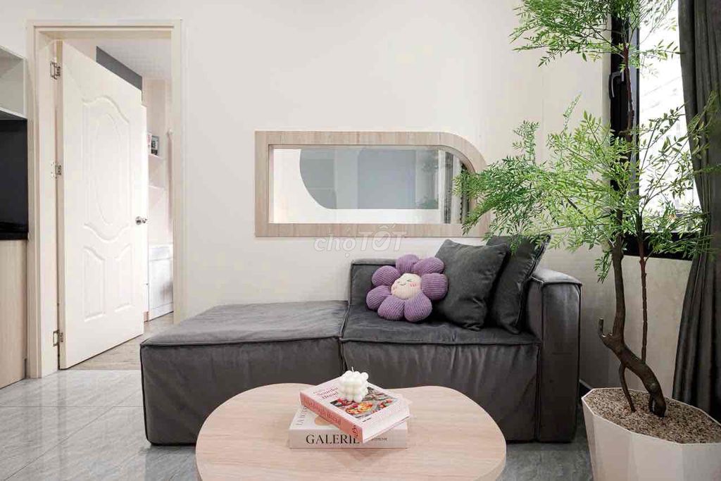 A mini apartment. A ballony bedroom. A wide open window.