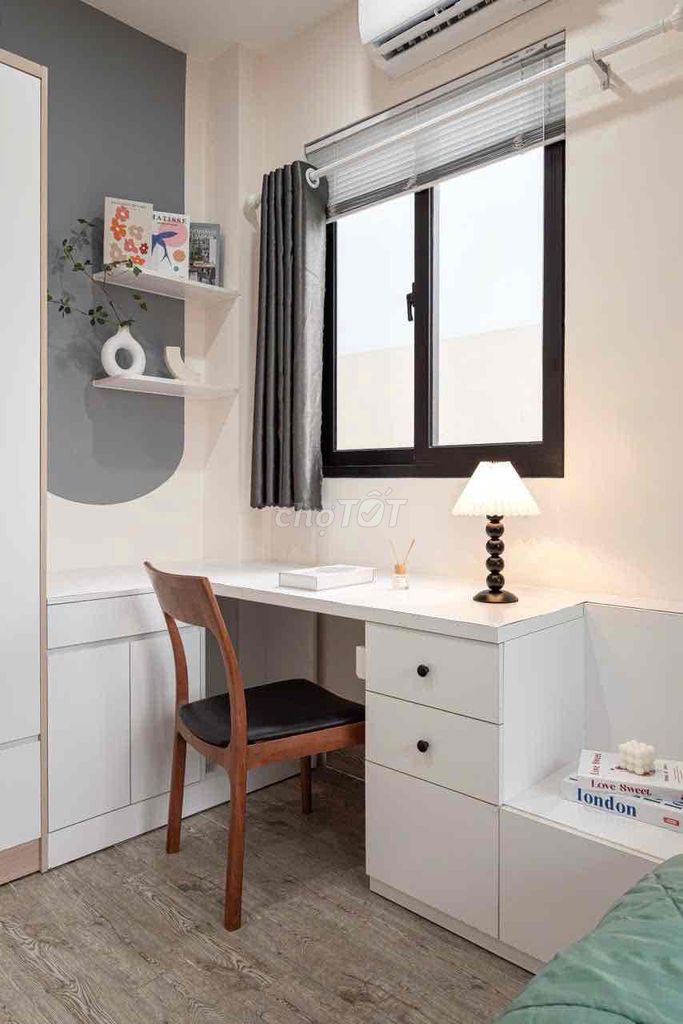 A mini apartment. A ballony bedroom. A wide open window.