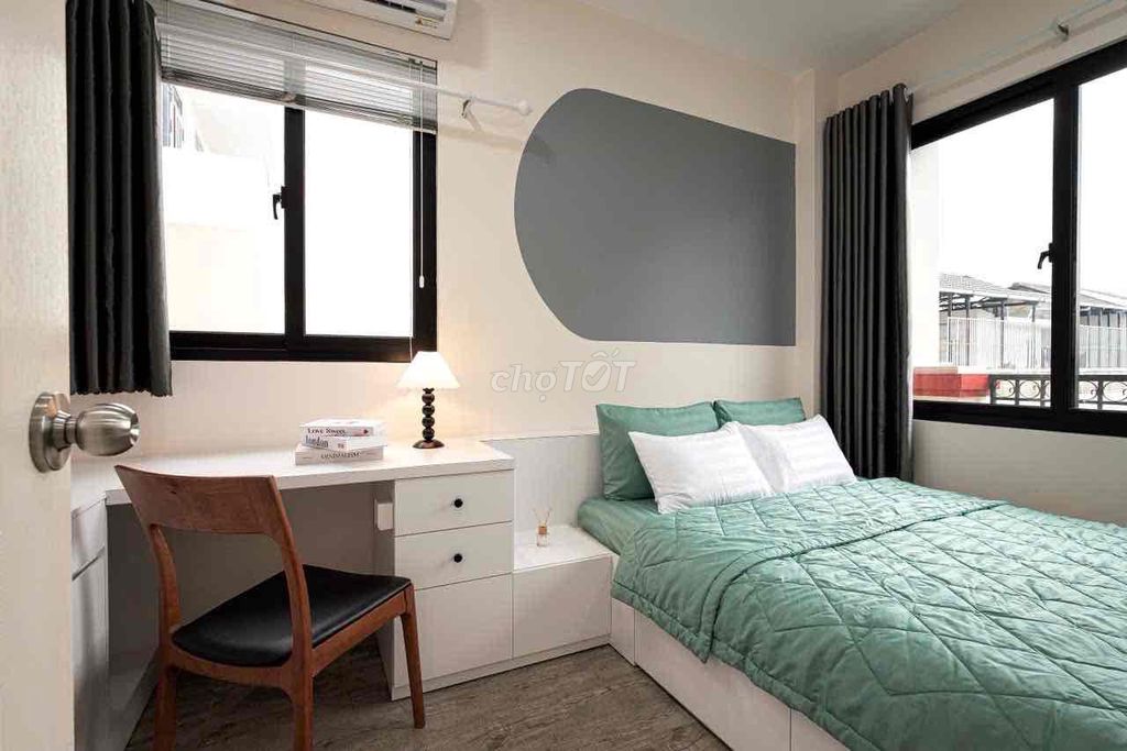 A mini apartment. A ballony bedroom. A wide open window.