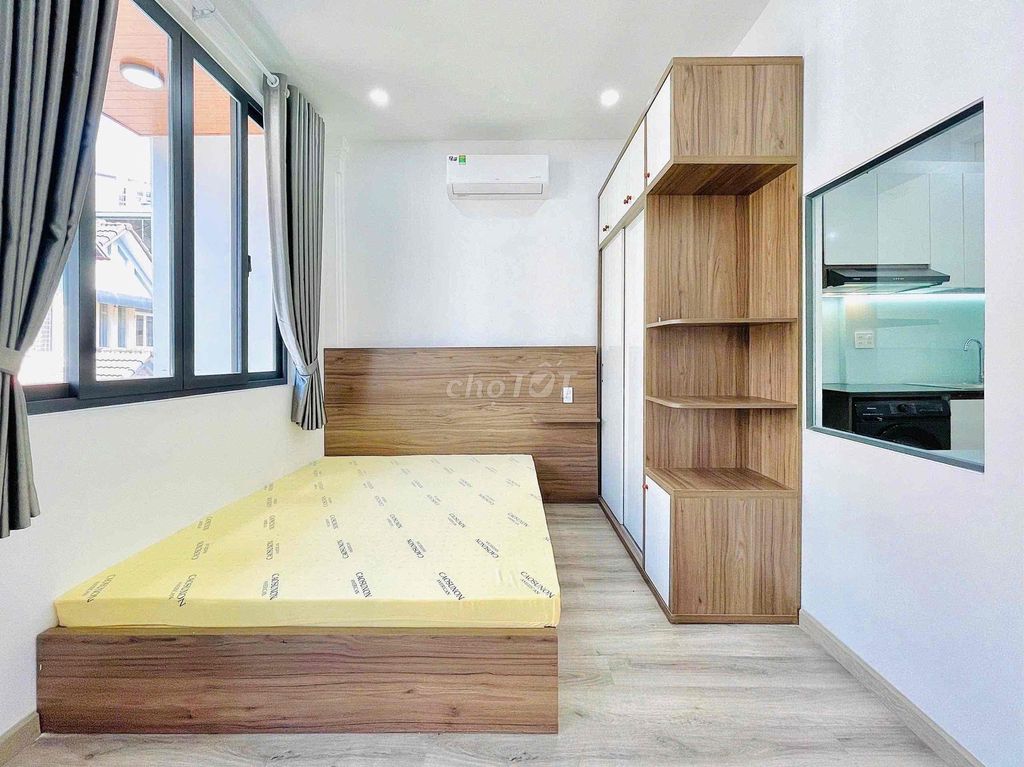 apartment one has a balcony on its way to the bar near the court.