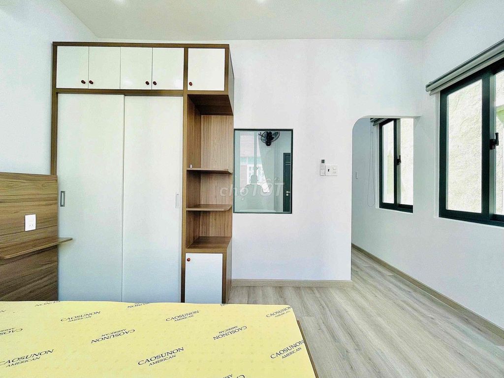 apartment one has a balcony on its way to the bar near the court.
