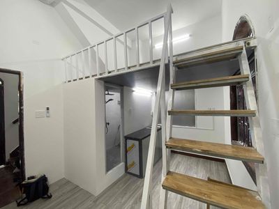 Opening apartment level level RSS apartment full of furniture with exposed floors.