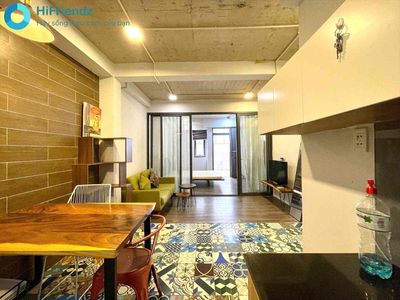 The 1st bedroom has a very large garden, the Great Face, full of people.
