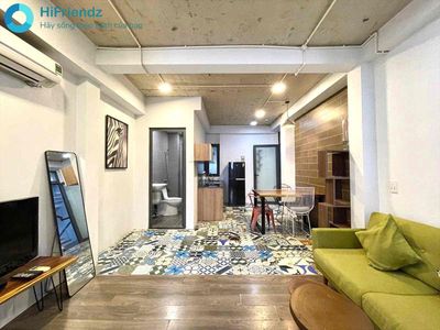 The 1st bedroom has a very large garden, the Great Face, full of people.