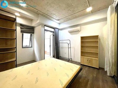 The 1st bedroom has a very large garden, the Great Face, full of people.