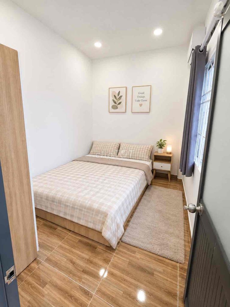 Two balcony bedrooms full of furniture - right on the 7th floor.