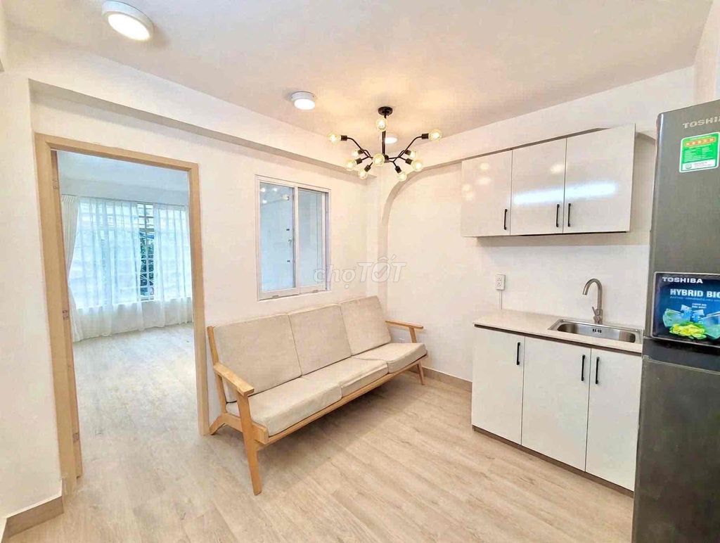 Small apartment one bedroom full of furniture.