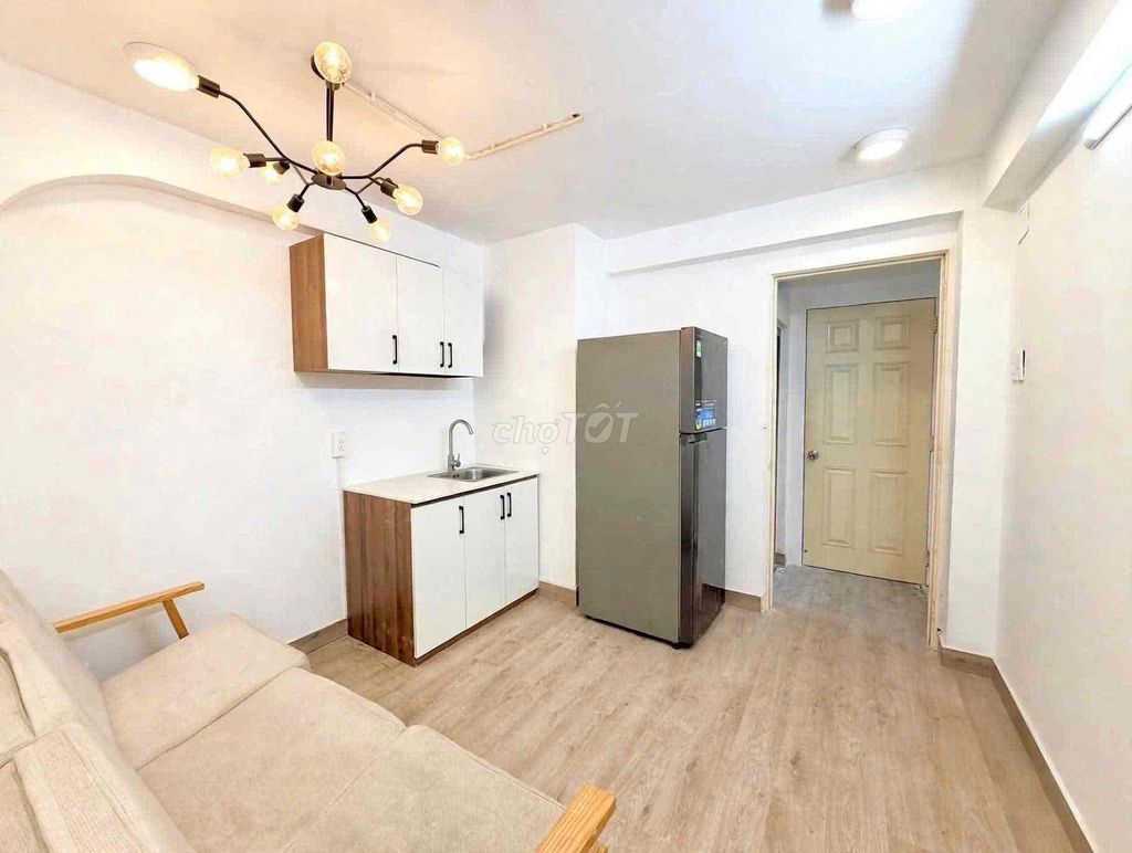 Small apartment one bedroom full of furniture.
