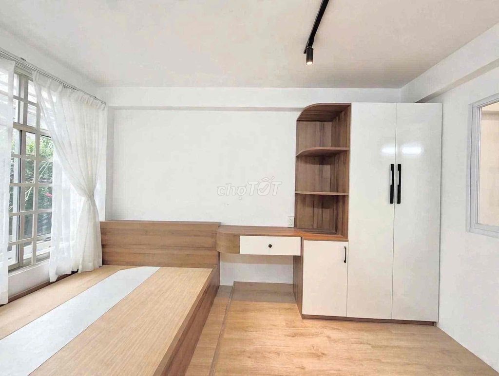 Small apartment one bedroom full of furniture.