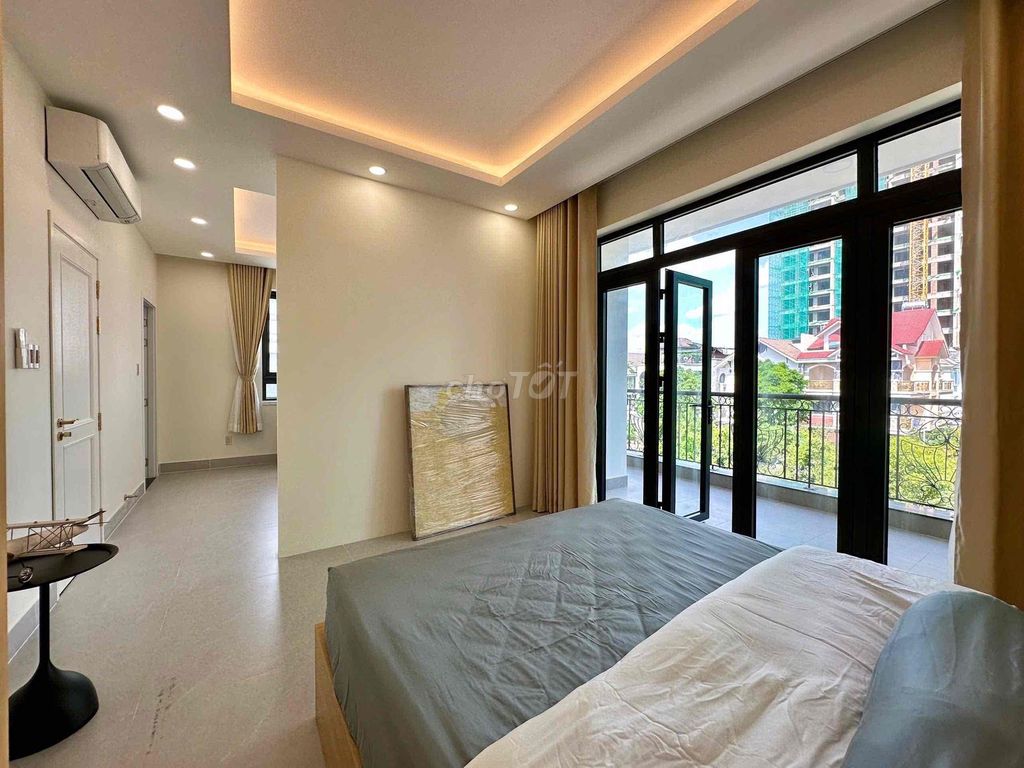 The apartment. A big balconies. A big Trương Văn Bang.
