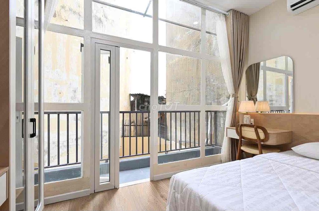 A super-spotty kitchen service apartment. An empty bedroom.
