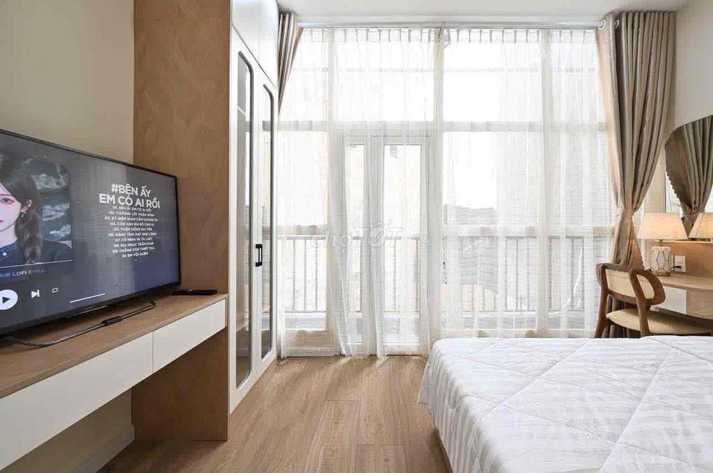 A super-spotty kitchen service apartment. An empty bedroom.